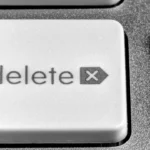 Close-up of a white delete key on a computer keyboard