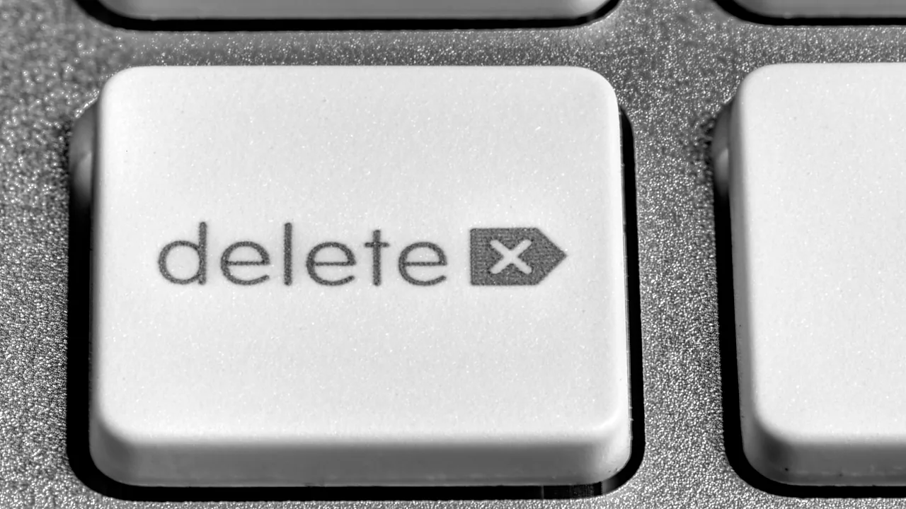 Close-up of a white delete key on a computer keyboard