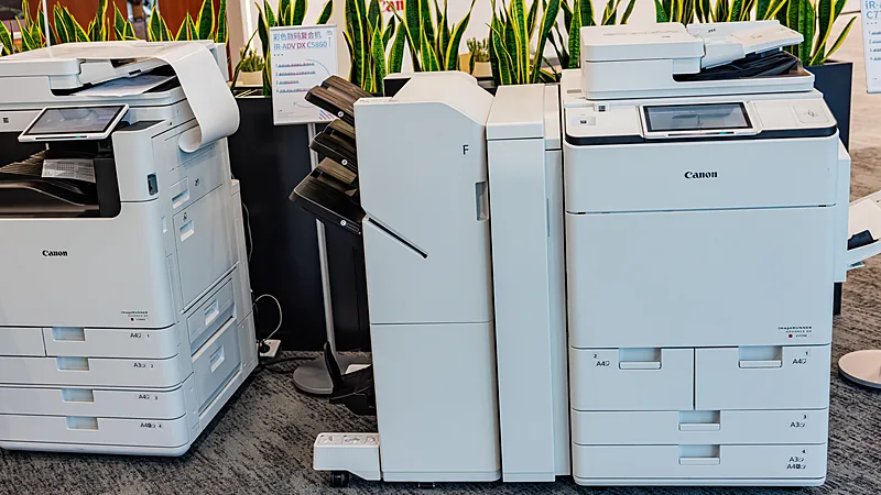 Two Canon imageRUNNER office multifunction printers side by side