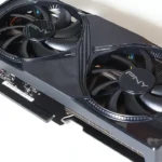 Black PNY Nvidia GeForce RTX 5060 Ti dual-fan graphics card lying on a white surface