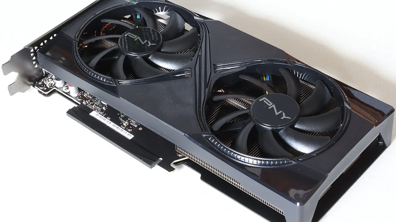 Black PNY Nvidia GeForce RTX 5060 Ti dual-fan graphics card lying on a white surface