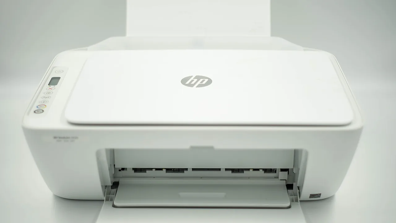 White HP DeskJet all-in-one printer with the HP logo