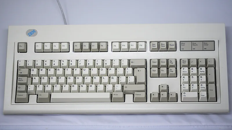 IBM Model M keyboard with Spanish layout on a white surface