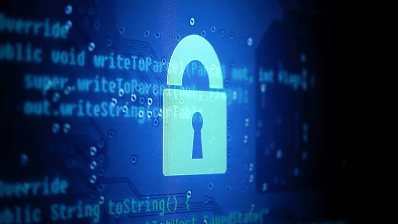 Glowing padlock over program source code on a dark screen