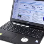 An open Lenovo G500s laptop showing a brightly lit web page on its screen
