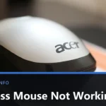 A white and black Acer wireless mouse resting on a sheet of paper, photographed close up, with the title Wireless Mouse Not Working across the lower part of the image.
