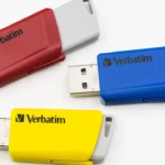 Three Verbatim Store n Click USB flash drives in red, blue and yellow